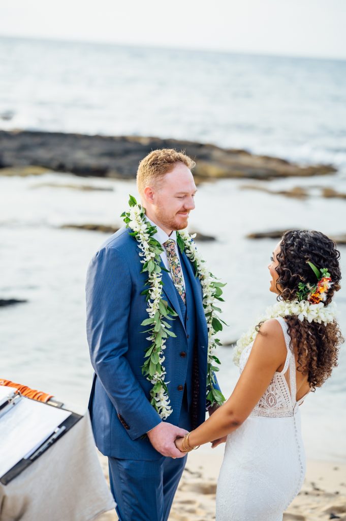 Wedding vows between bride and groom on the beach