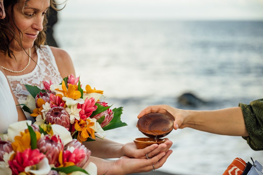 ring blessing during black sand beach elopement