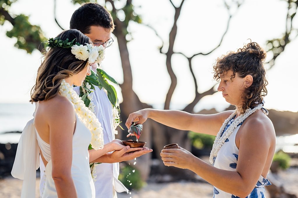 Blessing the rings during Hawaii elopement