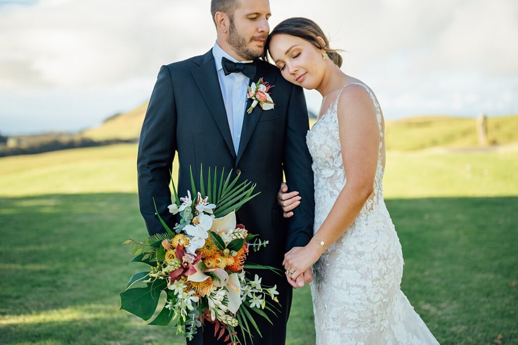 sweet moment of bride resting her head on the groom