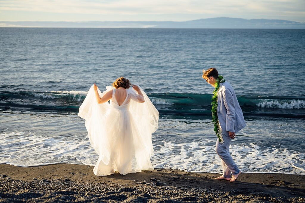 newlyweds dancing on the beach